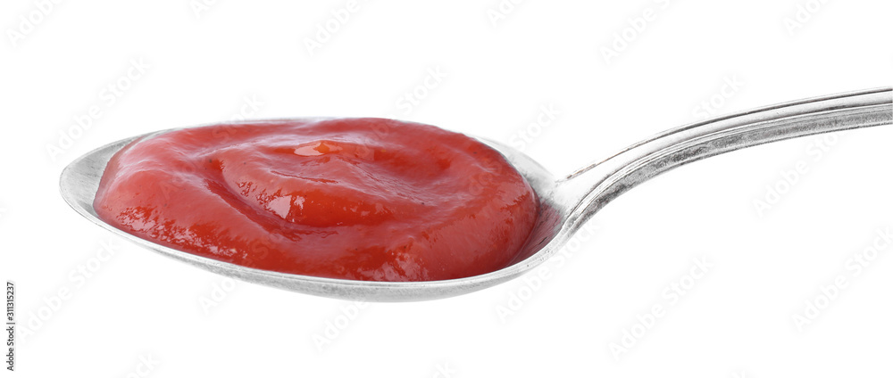 Tasty tomato sauce in spoon isolated on white Tasty tomato sauce in spoon isolated on white