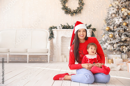 Happy mother with little so...