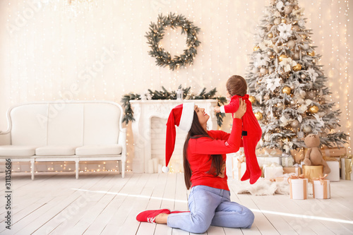 Happy mother with little so...