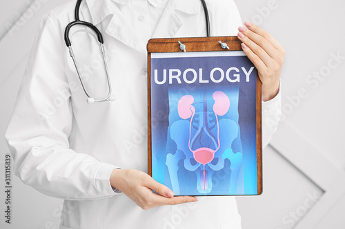 Doctor holding picture of u...