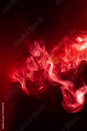 Red smoke motion on black background.