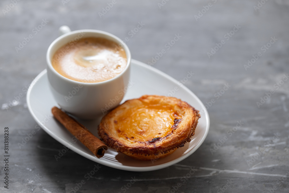 typical portuguese egg tart with cup of coffee typical portuguese egg tart with cup of coffee