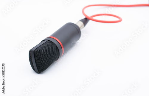 Sound studio. Microphone with cable isolated on white background
