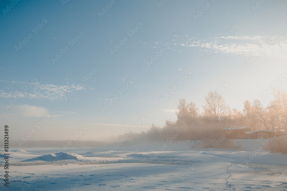 Shore of a frozen lake in the morning at dawn Shore of a frozen lake in the morning at dawn