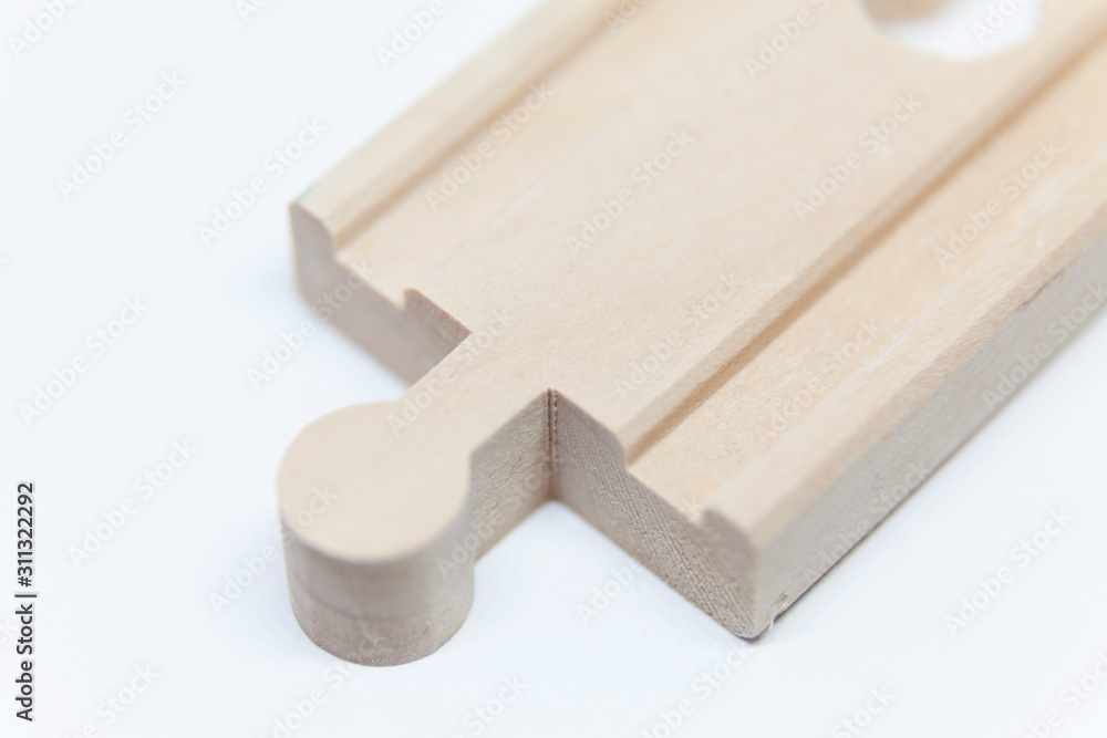 train rails of wood to toy train on white background train rails of wood to toy train on white background