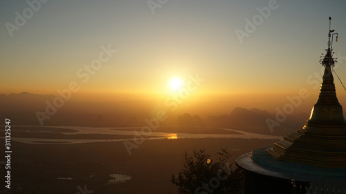 Sunset seen on top of the Mount Zwegabin Pagoda in Hpa-An, Myanmar / Burma. photo