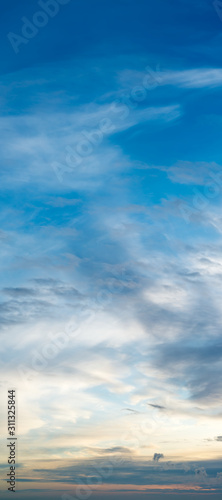 Fantastic clouds against blue sky, panorama