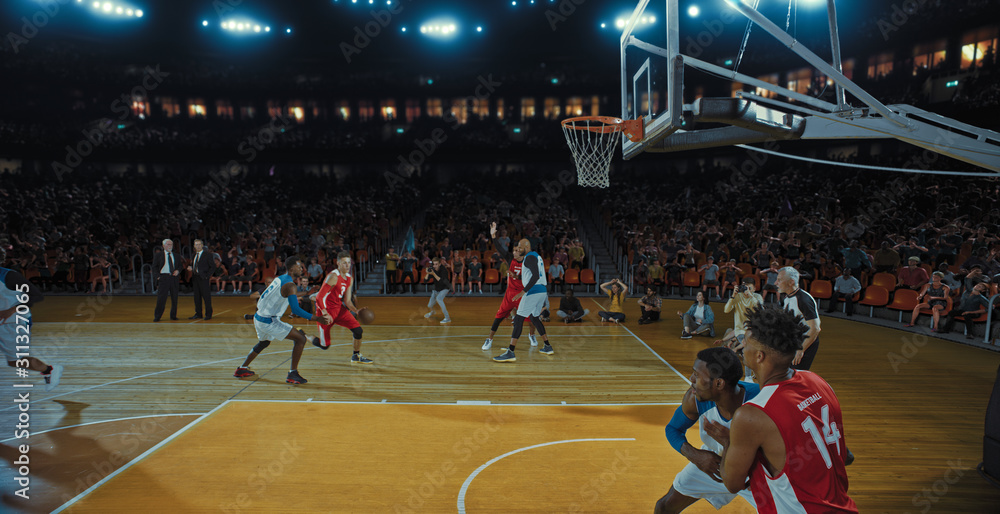 Fototapeta premium Basketball players on big professional arena during the game. Tense moment of the game. Celebration