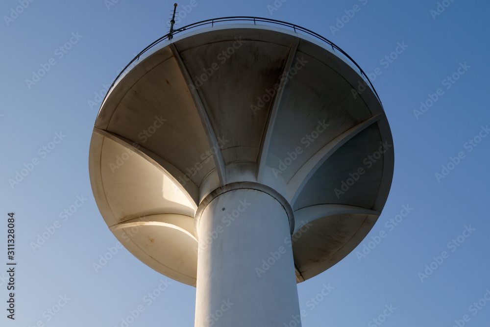       round concrete tower on a background of blue sky             