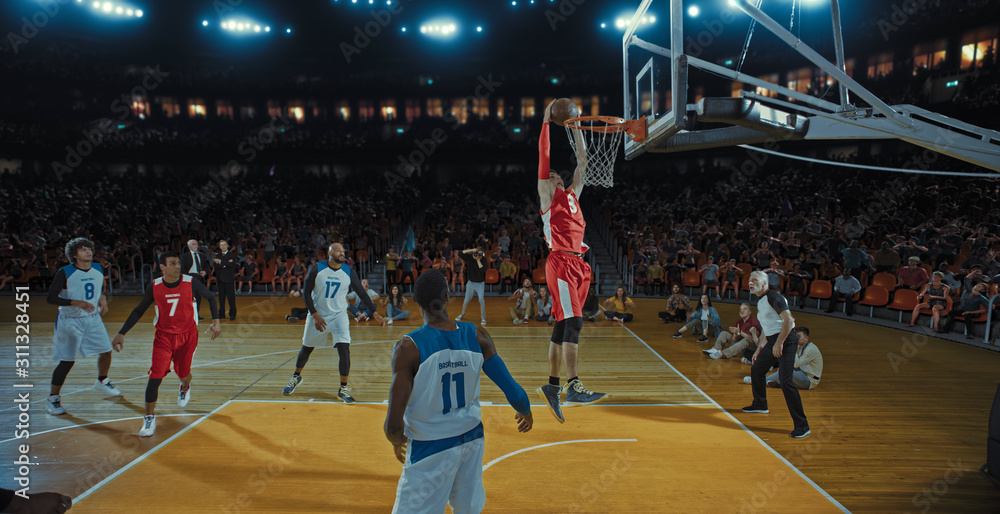 Obraz premium Basketball players on big professional arena during the game. Tense moment of the game. Celebration