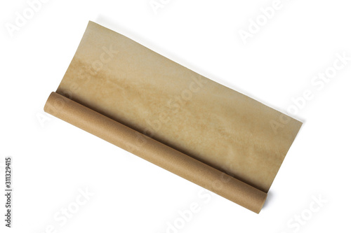 Baking paper roll isolated on white background. Brown parchment in a roll. Baking paper roll