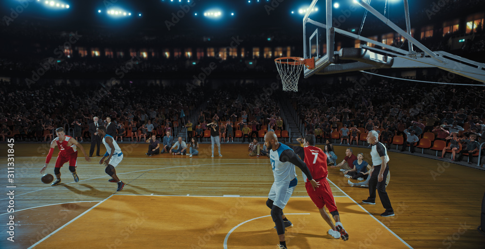 Fototapeta premium Basketball players on big professional arena during the game. Tense moment of the game. Celebration