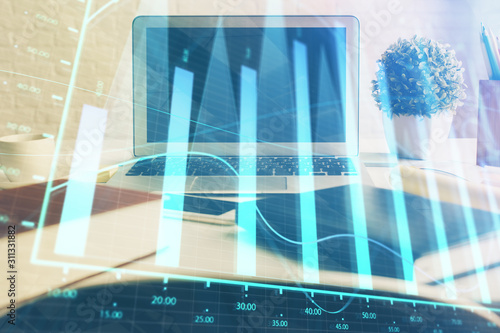 Stock market graph and table with computer background. Double exposure. Concept of financial analysis.