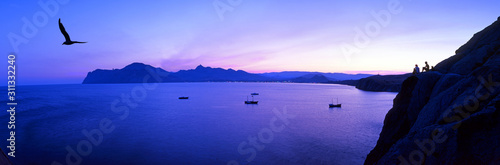 Panoramic view of the evening Koktebel. Mountains and sea at sunset.