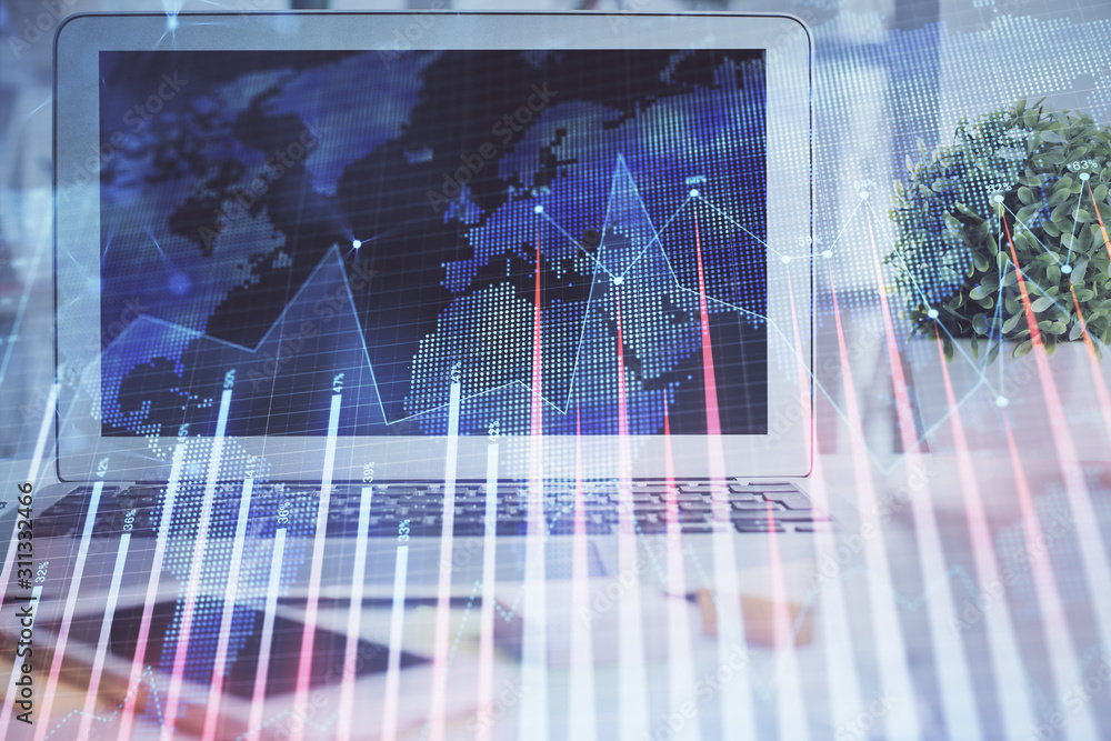 Forex market graph hologram and personal computer on background. Multi exposure. Concept of investment. Forex market graph hologram and personal computer on background. Multi exposure. Concept of investment.