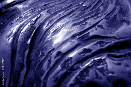 Metal rough surface with blur effect in blue tone.