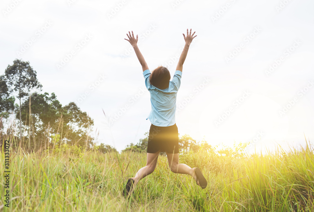 woman jumping in happy time with field background woman jumping in happy time with field background
