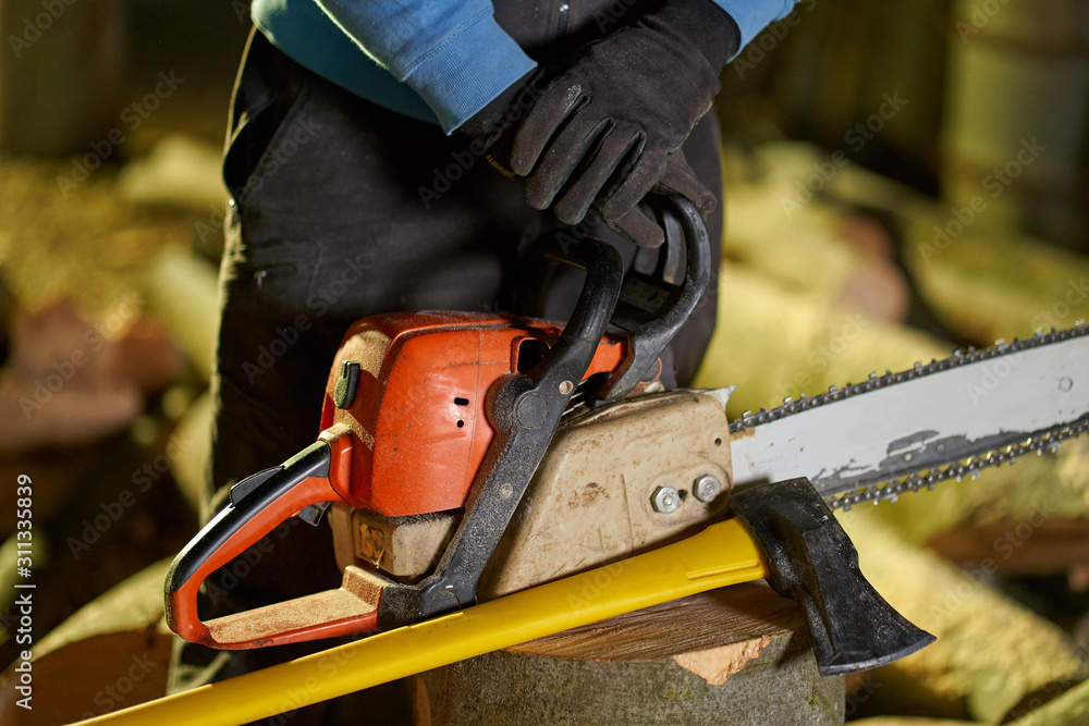 Lumberjack hands and tools Lumberjack hands and tools