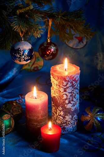 Christmas candles on blue background