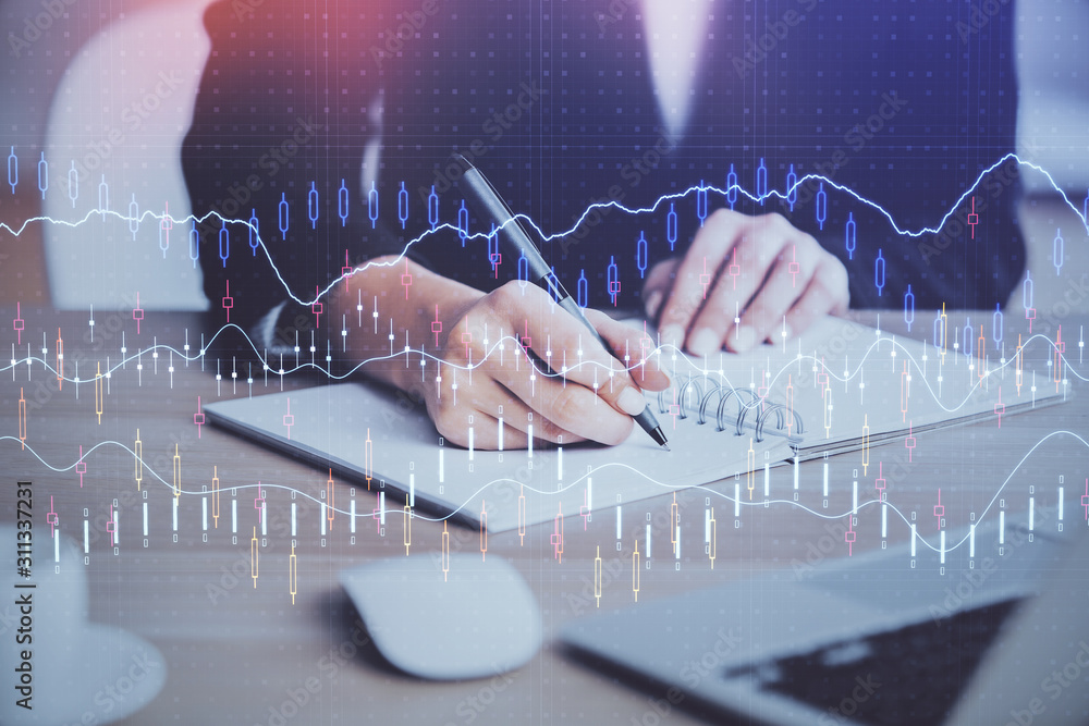 Forex graph on hand taking notes background. Concept of research. Multi exposure Forex graph on hand taking notes background. Concept of research. Multi exposure