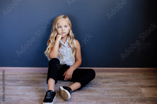 Little fashion girl model posing.