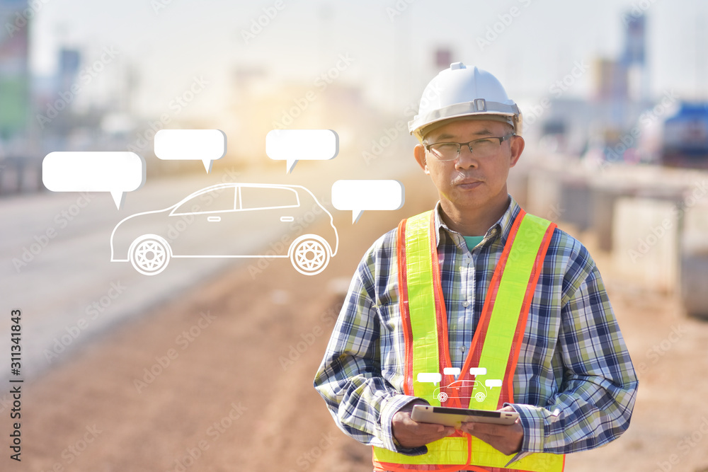 Fototapeta premium Senior Engineering holding tablet data technology working on road construction site