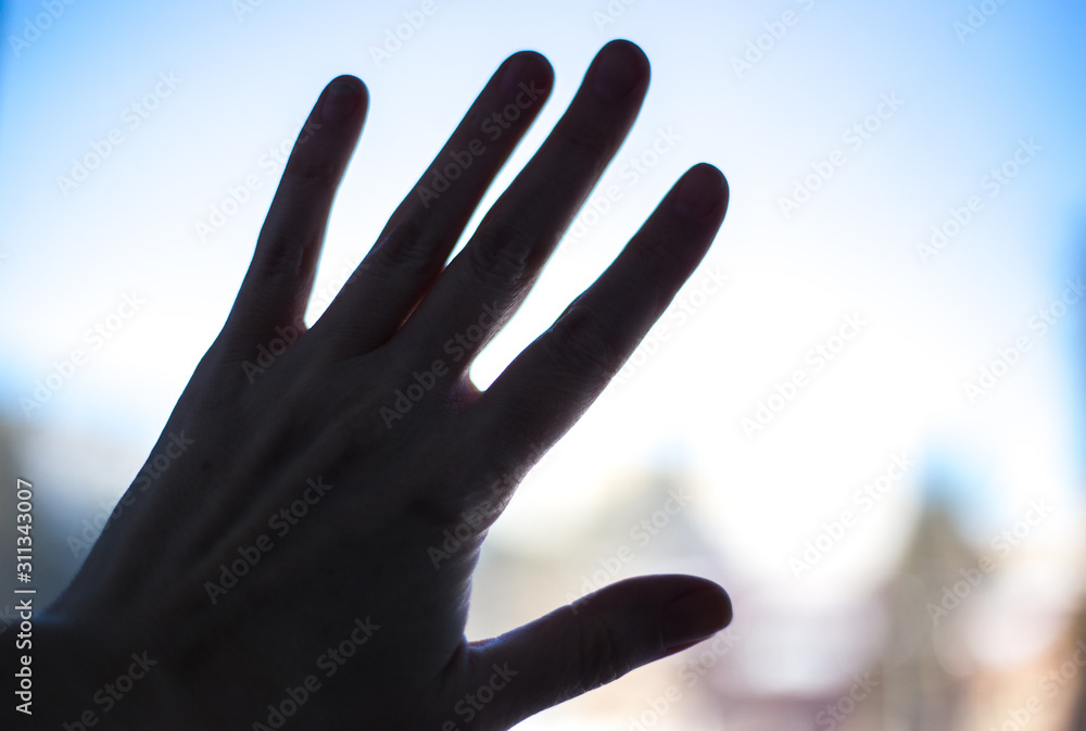 woman's hand outline on the glass