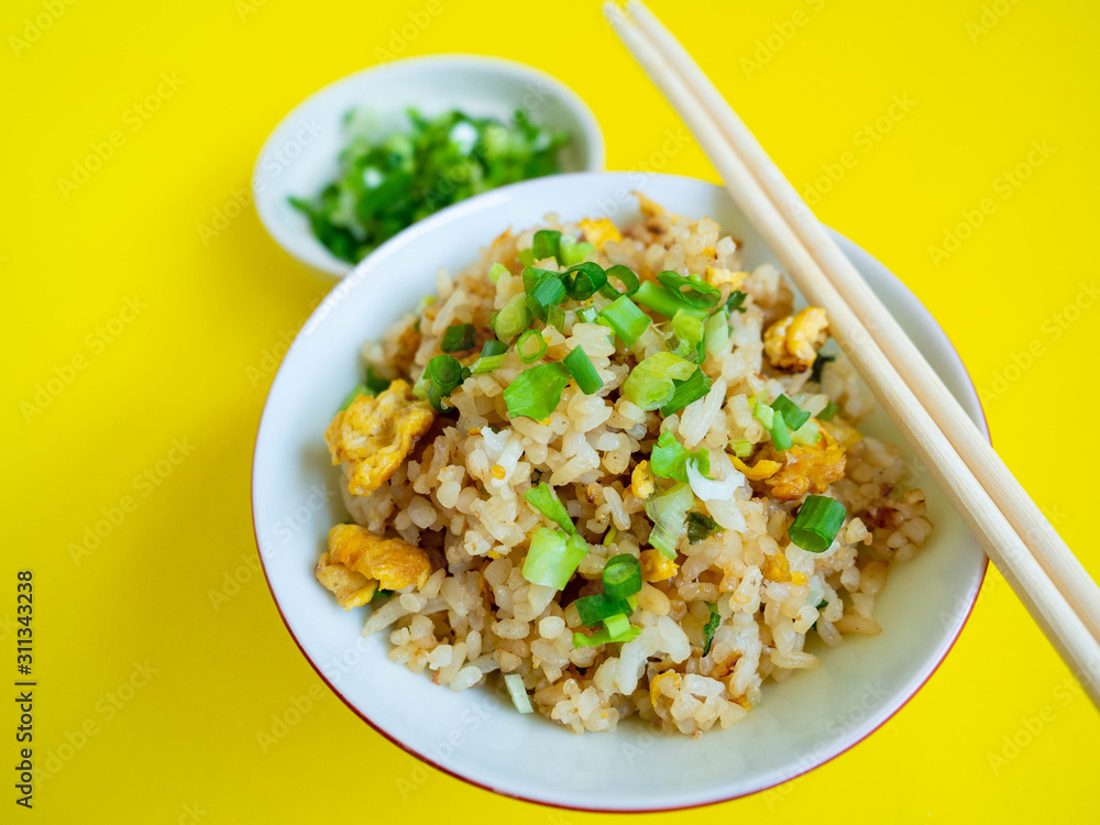 Fried rice with chicken ingredient Rice Egg Soy sauce Sugar Pepper Spring onion Food in Asian,Background wood