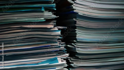 Stacks of old documents in the old archive. Brown, old data files.