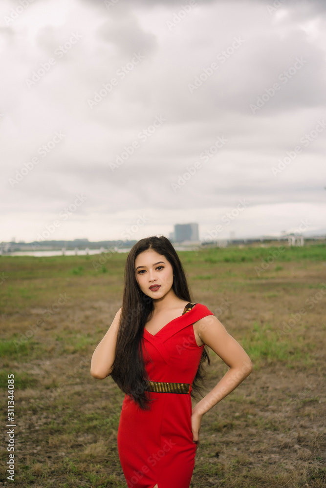 Potraiture beautiful women wear red dress at outdoor Potraiture beautiful women wear red dress at outdoor