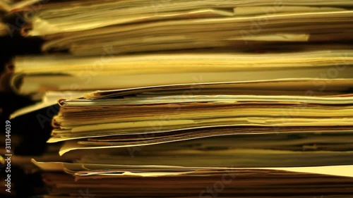 Stacks of old documents in the old archive. Brown, old data files.