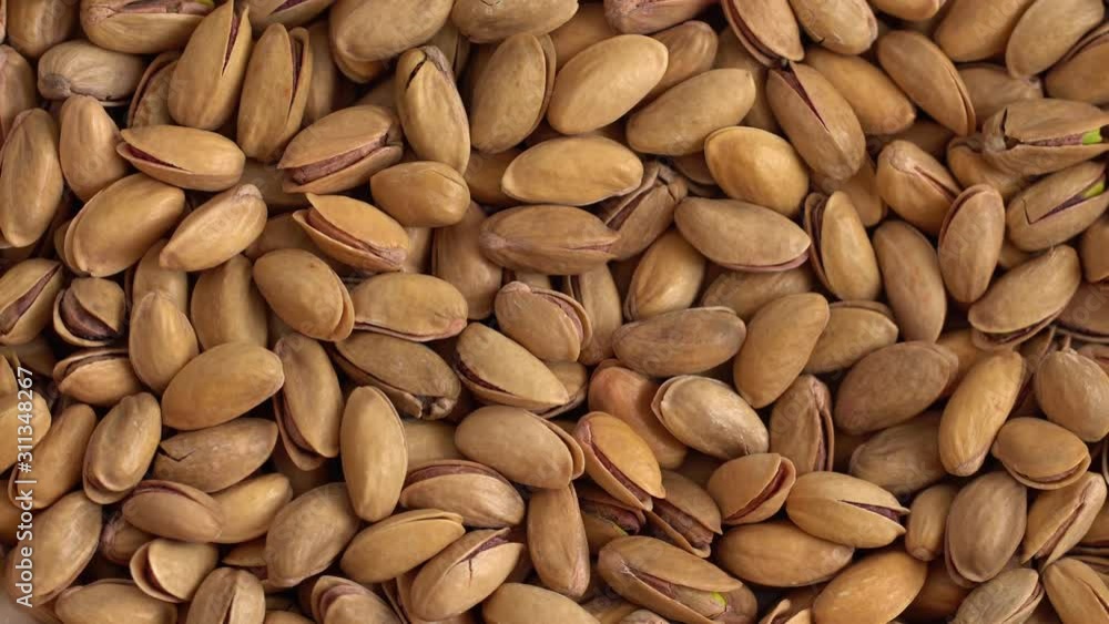 Roasted pistachios close-up. Pistachio nut with salt. macro Roasted pistachios close-up. Pistachio nut with salt. macro