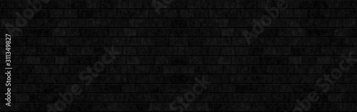 Abstract black brick wall texture for background or wallpaper design. panorama picture.