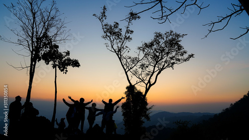 A group of tourists on Doi Inthanon  Thailand  watching the sunrise in the morning.