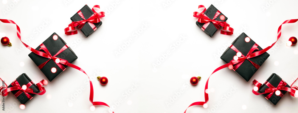 Xmas background. Red Christmas gifts, ornaments on white background top view. Winter holiday xmas present. Merry Christmas and Happy Holidays greeting card, frame, banner. New Year. Noel. Flat lay Xmas background. Red Christmas gifts, ornaments on white background top view. Winter holiday xmas present. Merry Christmas and Happy Holidays greeting card, frame, banner. New Year. Noel. Flat lay