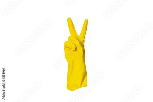 Yellow rubber glove for cleaning shows a gesture on a white isolated background. Two fingers