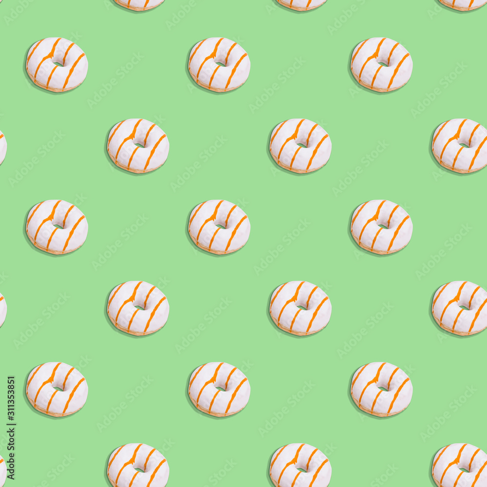 Seamless pattern with a donut in white glaze on a Neo-Mint color background. color trend 2020 Seamless pattern with a donut in white glaze on a Neo-Mint color background. color trend 2020