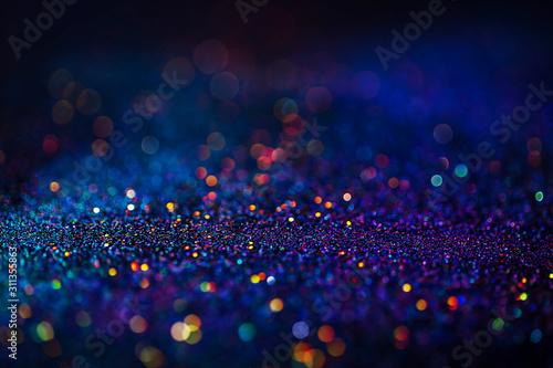 Shiny multicolor glitter raster background. Abstract shimmering pink, blue, yellow circles decorative backdrop. Bokeh lights effect illustration. Overlapping glowing and twinkling spots.