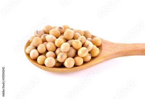 soybeans in wooden spoon on white