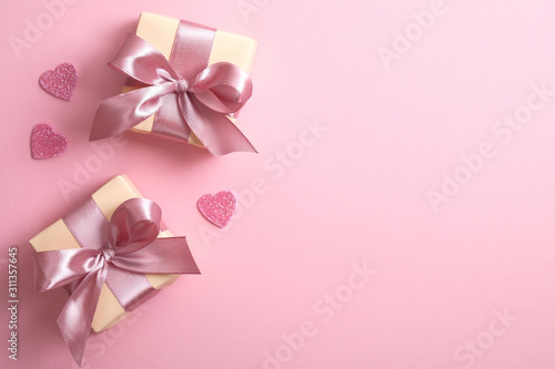 Valentines hearts with gift box on pink background. Greeting card design with symbols of love for Happy Women s  Mother s  Valentine s Day  birthday