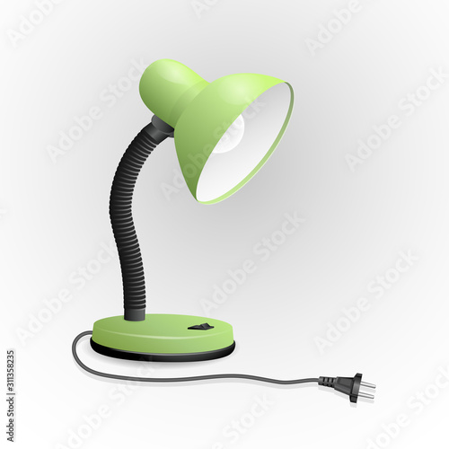 Green table lamp with electric cord with fork.