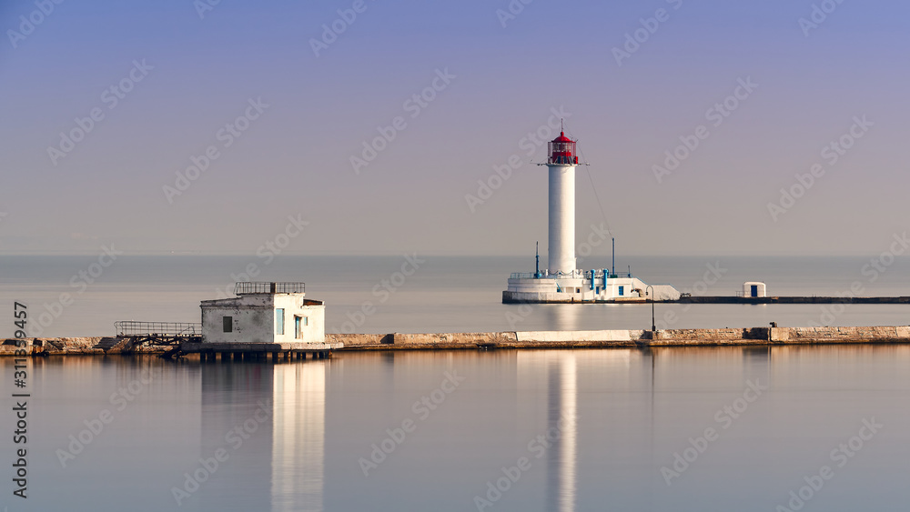 Sea lighthouse near cargo port
