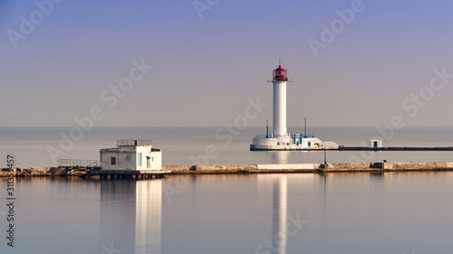 Sea lighthouse near cargo port
