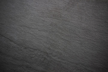 Dark grey black slate background or texture.