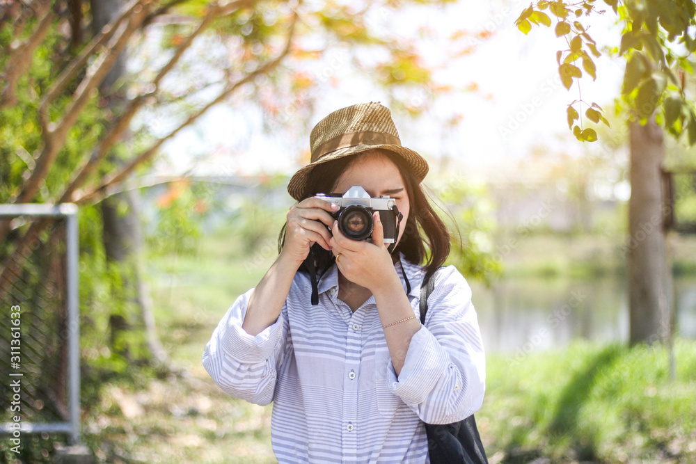 young girl with a film camera young girl with a film camera