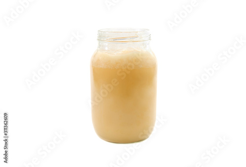 jar with honey isolated on a white background. Front view.