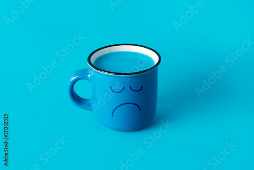 Obraz na plátně blue mug with a sad face