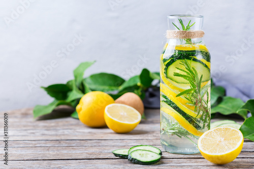 Fresh cool lemon cucumber rosemary infused water detox drink photo