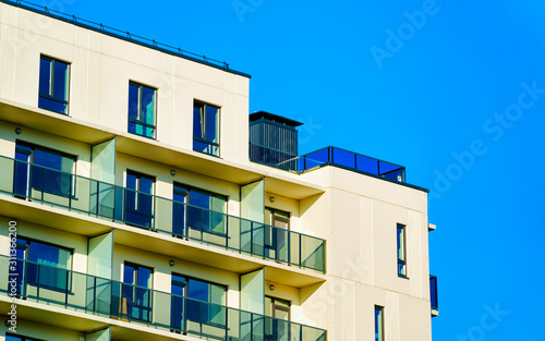 Residential apartment house facade and blank copy space reflex