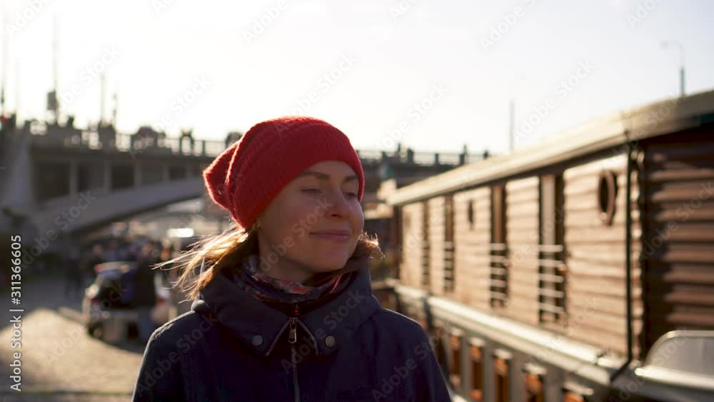 Young woman in red hat walking Prague promenade bridge ship sunny background Young woman in red hat walking Prague promenade bridge ship sunny background
